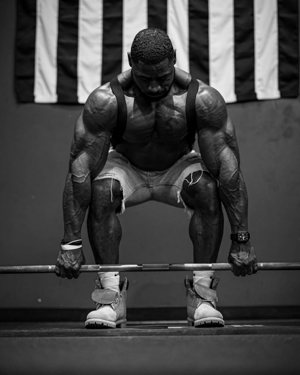 muscular bodybuilder lifting barbell